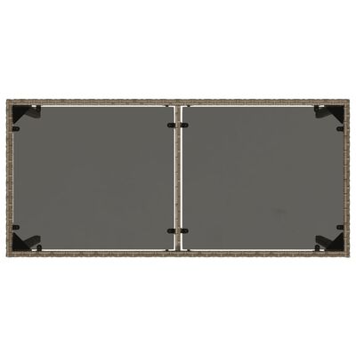 vidaXL Tuintafel met glazen blad 115x54x74 cm poly rattan grijs