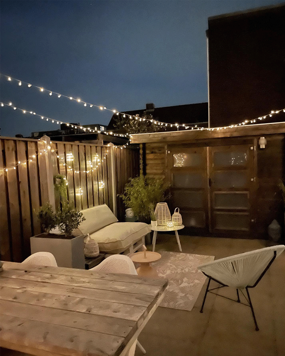 Backyard seating area with lots of light sources