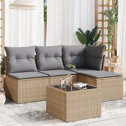 Rotan tuinset met grijze kussens op terras.